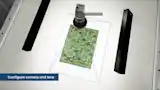 一台配备远心镜头和红色环形光源的高分辨率GigE相机正在检测一块PCB